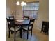 Charming dining area featuring a round table with four chairs and decorative accents at 4677 Nw 46Th Ave, Ocala, FL 34482