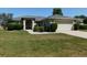 Well-maintained home featuring manicured landscaping, two car garage, and a welcoming front entrance at 4677 Nw 46Th Ave, Ocala, FL 34482