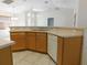 Bright kitchen with breakfast bar, neutral countertops, and stainless steel sink at 4677 Nw 46Th Ave, Ocala, FL 34482