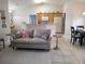 Open living room showcasing seamless transition to kitchen with modern appliances at 4677 Nw 46Th Ave, Ocala, FL 34482