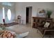 Spacious living room with entryway, rustic cabinet, and comfortable seating area at 4677 Nw 46Th Ave, Ocala, FL 34482