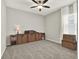 Bright, unfurnished room featuring plush carpeting, natural light, and built in shelving at 4806 Nw 8Th Ter, Ocala, FL 34475