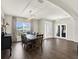 Large dining room with open floor plan features a wooden table, elegant lighting, and access to other areas at 4806 Nw 8Th Ter, Ocala, FL 34475