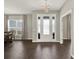 Bright and airy foyer with stylish flooring, a glass door, and neutral wall paint at 4806 Nw 8Th Ter, Ocala, FL 34475