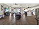Open concept living room featuring modern furniture, hardwood floors, and abundant natural light at 4806 Nw 8Th Ter, Ocala, FL 34475