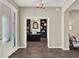 View into the office featuring dark built-in shelves, an elegant desk, and wood-look tile floors at 4806 Nw 8Th Ter, Ocala, FL 34475