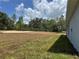 A large and partially green backyard at 4928 Sw Evergreen Ct, Dunnellon, FL 34431