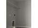 Laundry room with new flooring, washer and dryer hookups, and a wire storage shelf above at 4928 Sw Evergreen Ct, Dunnellon, FL 34431