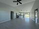 A bright, open-concept kitchen with an island, granite countertops, and stainless steel appliances at 4928 Sw Evergreen Ct, Dunnellon, FL 34431
