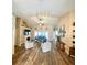 Spacious living room with wood floors, fireplace, and view to the lanai at 4981 Ne 110Th Street Ne St, Anthony, FL 32617