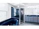 Well-lit bathroom with a large soaking tub, tiled floors, and and sinks at 5365 Sw 111Th Lane Rd, Ocala, FL 34476