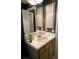 Close-up view of bathroom vanity, sink, and mirror, with plenty of storage at 5365 Sw 111Th Lane Rd, Ocala, FL 34476