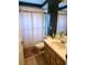 Bathroom with shower/tub, toilet, vanity, mirror, and tiled floors at 5365 Sw 111Th Lane Rd, Ocala, FL 34476