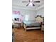 Bright bedroom featuring a ceiling fan, wood floors, and a modern vanity area at 5365 Sw 111Th Lane Rd, Ocala, FL 34476