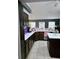 Well-equipped kitchen with dark wood cabinets, stainless steel appliances, and a central island at 5365 Sw 111Th Lane Rd, Ocala, FL 34476