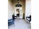 Inviting front patio features tile flooring and comfortable outdoor seating at 5365 Sw 111Th Lane Rd, Ocala, FL 34476