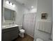 Bright bathroom with a stylish vanity, neutral paint, and modern fixtures at 5785 Sw 87Th Court Rd, Ocala, FL 34481