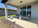 Relaxing covered patio with outdoor seating and view of the backyard at 5785 Sw 87Th Court Rd, Ocala, FL 34481