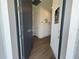 Inviting entryway with a modern front door and stylish wood-look tile flooring at 5785 Sw 87Th Court Rd, Ocala, FL 34481