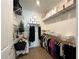 Spacious walk-in closet with ample shelving and hanging space for organized storage at 5785 Sw 87Th Court Rd, Ocala, FL 34481