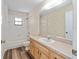 Bathroom with a vanity, toilet and a tub shower combo, perfect for relaxation and convenience at 6057 Se 39Th Ave, Ocala, FL 34480