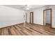 Spacious bedroom featuring modern wood floors, a ceiling fan and a closet for storage at 6057 Se 39Th Ave, Ocala, FL 34480