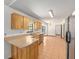 Bright kitchen with light wood cabinetry, stainless steel appliances, and tile flooring at 6057 Se 39Th Ave, Ocala, FL 34480