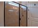 Shower with glass door and tiled walls at 6132 Sw 94Th Ter, Ocala, FL 34481