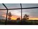 Wonderful sunset view from the screened-in lanai, showcasing the picturesque scenery at 6132 Sw 94Th Ter, Ocala, FL 34481