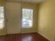 Bright entryway with natural light, wood laminate floors, and a neutral color palette at 621 Ne 20Th St, Ocala, FL 34470