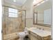 Well-appointed bathroom featuring a glass-enclosed shower and a marble-topped vanity at 6882 Sw 113Th Pl, Ocala, FL 34476