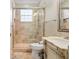 Bathroom features a glass shower, and a vanity with marble countertops at 6882 Sw 113Th Pl, Ocala, FL 34476