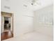 Bedroom with hardwood floors and shutters on the windows at 6882 Sw 113Th Pl, Ocala, FL 34476
