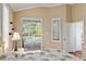 Bedroom view onto the pool area through sliding glass doors and custom shutters at 6882 Sw 113Th Pl, Ocala, FL 34476