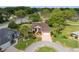 An inviting home with a circular driveway and lush landscaping at 6882 Sw 113Th Pl, Ocala, FL 34476