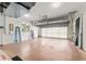 Bright and spacious garage interior with an opened garage door at 6882 Sw 113Th Pl, Ocala, FL 34476