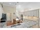 Bright kitchen with granite countertops, an island, stainless steel appliances, and tile backsplash at 6882 Sw 113Th Pl, Ocala, FL 34476