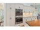 Kitchen featuring white cabinets, granite countertops, stainless appliances, and double ovens at 6882 Sw 113Th Pl, Ocala, FL 34476