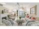 Spacious living room featuring tile floors, fireplace, and a large window for natural light at 6882 Sw 113Th Pl, Ocala, FL 34476
