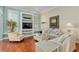 Cozy living room featuring a neutral color scheme, wood floors, and stylish furniture at 6882 Sw 113Th Pl, Ocala, FL 34476