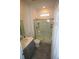 Bathroom featuring a glass-enclosed shower and vanity with modern fixtures at 7429 Sw 61St St, Ocala, FL 34474