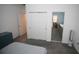 Well-lit bedroom leading to the bathroom, featuring a closet with sliding doors at 7429 Sw 61St St, Ocala, FL 34474