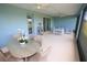 Relaxing screened lanai with comfortable seating, ceiling fans, outdoor dining, and a peaceful view at 7429 Sw 61St St, Ocala, FL 34474