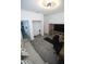 Comfortable living room featuring a sofa, TV, and storage, perfect for relaxation at 7429 Sw 61St St, Ocala, FL 34474