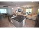 Open-concept living space with a kitchen island, dining area, and comfortable seating at 7429 Sw 61St St, Ocala, FL 34474