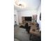 Bright home office featuring a built-in bookshelf, large desk, and modern lighting fixture at 7429 Sw 61St St, Ocala, FL 34474
