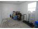 A spacious storage room with neutral colors, multiple mirrors, and a high window for natural light at 7429 Sw 61St St, Ocala, FL 34474