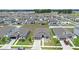 Aerial view of a community showcasing single-Gathering homes with well-manicured lawns and consistent architectural design at 7571 Sw 64Th Street Rd, Ocala, FL 34474