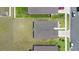 Bird's-eye view of the home's roof and surrounding landscaping in a residential neighborhood with nearby streets at 7571 Sw 64Th Street Rd, Ocala, FL 34474