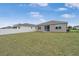 Spacious backyard featuring a well-maintained lawn and a secure white fence, perfect for outdoor enjoyment at 7571 Sw 64Th Street Rd, Ocala, FL 34474